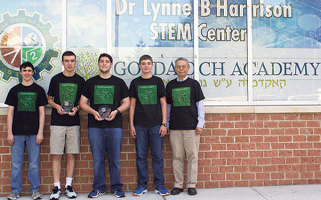 With adviser Dr. Arco Jeng, far right, are GOA’s CodeRunners RoboCup team members who will compete in the International RoboCup Junior Soccer Competition in Leipzig, Germany, later this month, from left, Aytan Geschwind, Benjamin Soudry, Alex Rothsc