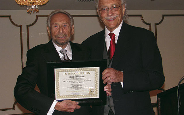 Norbert Gaelen, left, was honored at the annual Jewish Historical Society of MetroWest gala for his role as a founder and major benefactor in May 2011; presenting his certificate of recognition is then JHS president Howard Kiesel. 