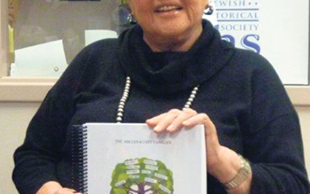 Susan Lowy Lubow displays her second publication based on her research into her family genealogy, The Abeles-Kussy Families, at the Jewish Historical Society of NJ. 
