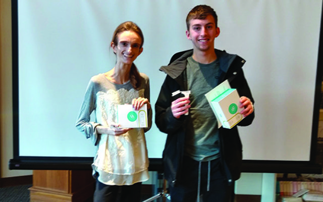 Rutgers students Dena Winchester, who has a rare genetic disease, and Oren Mendelow of West Orange, with the DNA genetic screening kits given to Jewish students in a drive conducted by JScreen. Photos by Debra Rubin 