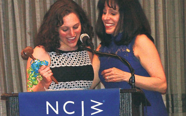 Melanie Harrison, left, passes the gavel to her mother, Shari Harrison, who was installed as the new president of NCJW/Essex.