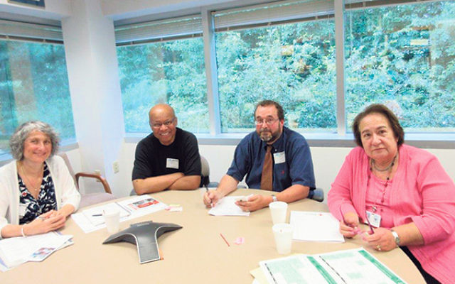 Among those who met in Whippany to discuss training chaplains in disaster relief are, from left, Jocelyn Gilman, the Rev. Willard Ashley, Rabbi Stephen Roberts, and Cecille Asekoff.     