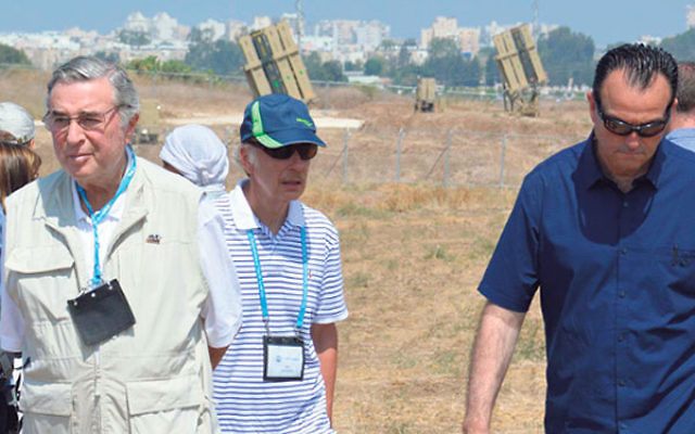 Len Posnock, left, and other JFNA solidarity mission members in front of Iron Dome installations.