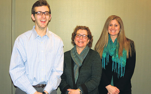 With support coordinator Maggie McCourt, right, at the JFS of MetroWest office in Florham Park are Harris Engel and his mother Helen.