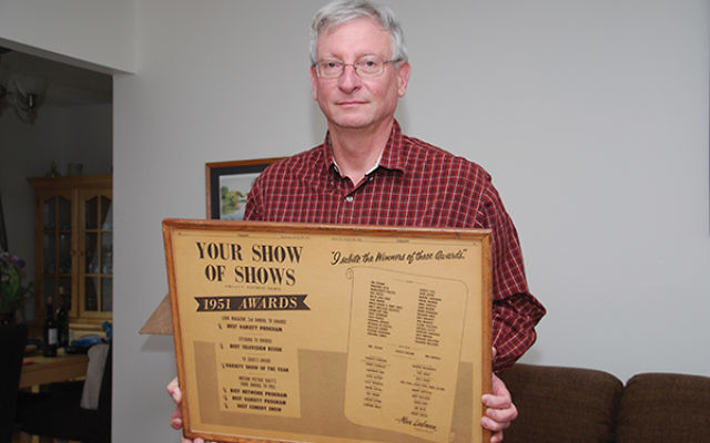 Barry Jacobsen, former assistant to “Your Show of Shows” producer Max Liebman, holds a promotional poster for the popular program.