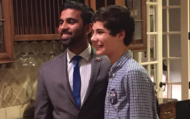 Jonah Altmann greets candidate Peter Jacob at a fund-raiser hosted by the teen in his Westfield home.