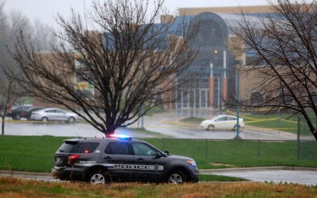 An Overland Park police vehicle sits in front of the Jewish Community Center of Greater Kansas City, Kan., following shootings there and later at a nearby assisted-living complex that killed a total of three people, April 13, 2014. (Jamie Squire/Getty Ima