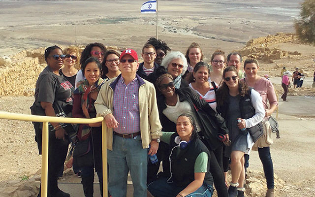 Max Kleinman led 15 students on a trip to the Negev as part of two weeks of study in Israel. Marianne Fontillas is at Kleinman’s right; Sheree Boone is third from left in the third row, just behind Fontillas.