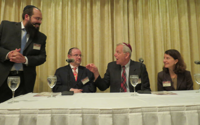 Rabbi Shalom Lubin, left, leader of Chabad of SE Morris County, throws ethical questions at, from left, Rabbi Michael Broyde, Dr. Kenneth Prager, and Sharona Hoffman.