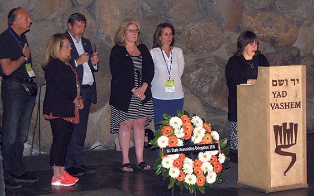 Laying a memorial wreath at Yad VaShem are, from left, Roy Tanzman, Brenda Tanzman, Mark Levenson, Assemblywoman Holly Schepesi, Assemblywoman Pamela Lampitt, and docent Malka Weisberg. 