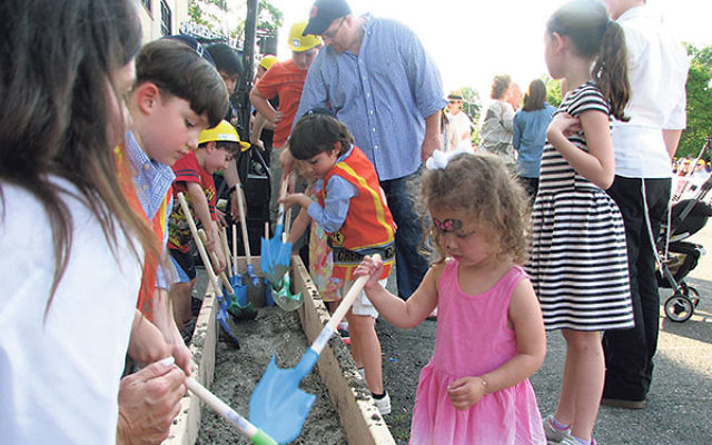 Even the smallest participants had the opportunity to mix cement for laying the cornerstone of LifeTown.