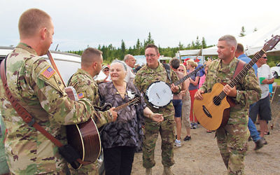 Luna Kaufman is serenaded by an Army quartet following the dedication of The Liberator Tree on July 23. 