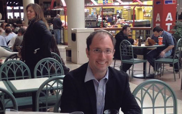Rabbi Ari Saks at his weekly table in the food court at the Menlo Park Mall has fielded questions and had discussions with both Jews and non-Jews on Israel, intermarriage, and Judaism.    