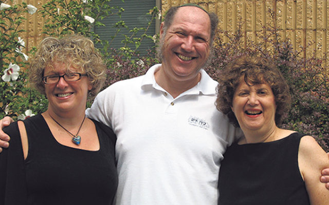 Linda Meisel, right, joins with Anne Berman-Waldorf and Rabbi Eric Wisnia of Congregation Beth Chaim in Princeton Junction in September 2008, at the launching of Promoting Healthy Families, an initiative of JFCS and the synagogue. 