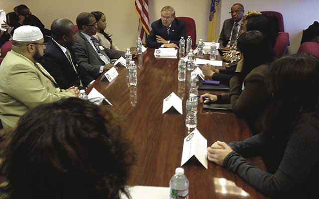 Sen. Robert Menendez briefs human rights experts and local community leaders on the kidnappings of hundreds of schoolgirls in Nigeria.     