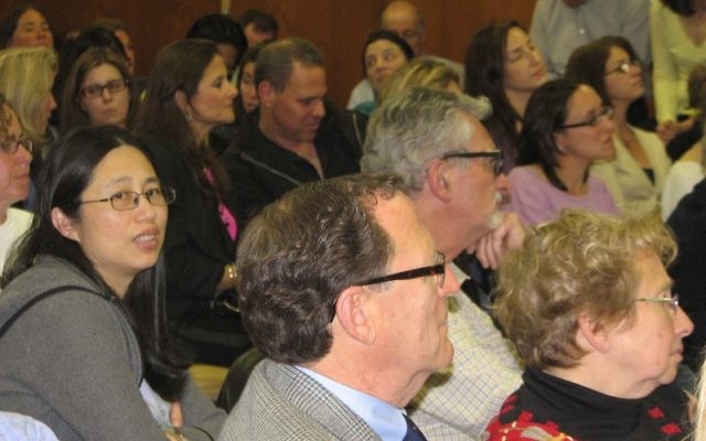 A diverse crowd of over 75 people attended the April 28 Millburn Township board of education meeting at the Education Building in Millburn.
