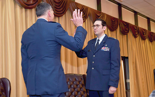 Col. Joseph Deichert administers the oath promoting Major Menashe Miller to lieutenant colonel. Photo courtesy of TheLakewoodScoop.com