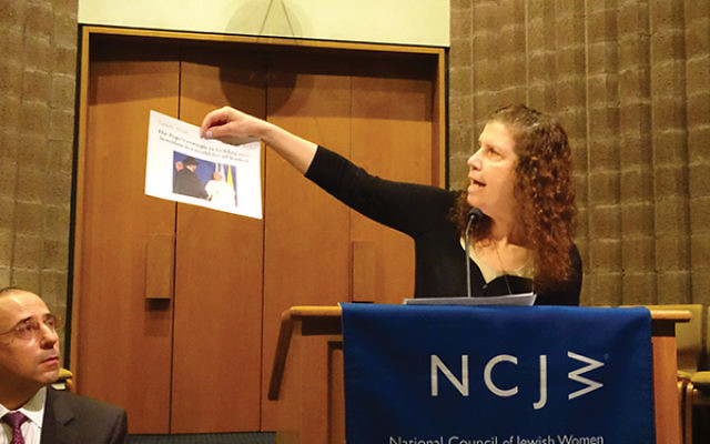 Brandishing news articles about interfaith cooperation in the face of bias crime, Susan Werk, education director at Congregation Agudath Israel, said children should be exposed to “positive stuff” to teach them how to behave.