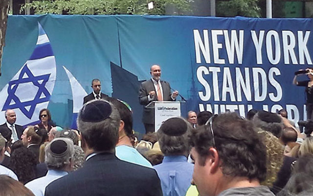 Israeli Ambassador to the UN Ron Prosor speaks to the 10,000 people gathered at the New York Stands with Israel Rally. 
