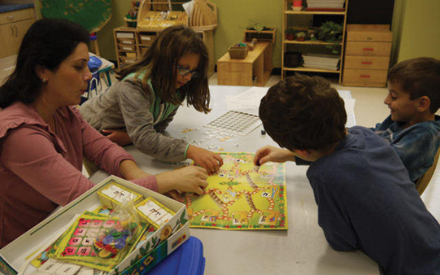 Playing board games is part of the Hebrew immersion program at Ofek.