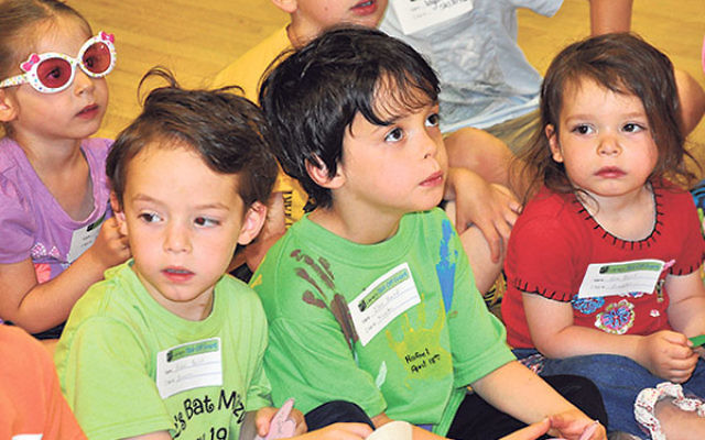 Children listen to a reading at the kick-off PJ Library event.