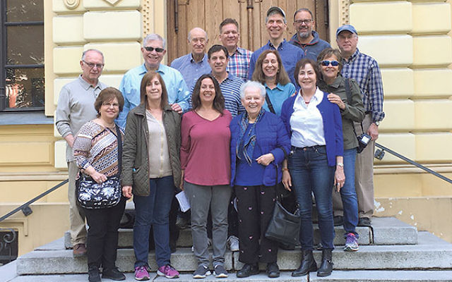 Mission members gather in front of the restored Nozyk Synagogue in Warsaw. 