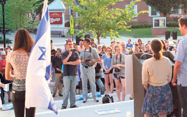 More than 200 students and area residents gathered on the steps of Brower Hall at Rutgers University July 1 to attend a memorial vigil for the three students murdered in Israel. 