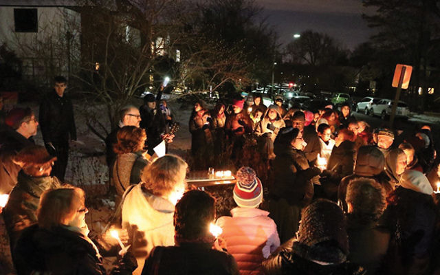 Bnai Keshet announced it would offer physical sanctuary to undocumented immigrants at a ceremony that began with a menorah lighting. Photos by Peter Wert