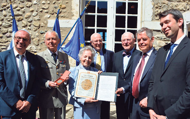 At the July ceremony inducting Count Xavier and Countess Marie-Francoise de Virieu as Righteous Among the Gentiles at Yad Vashem are, from left, Yad Vashem representative Joseph Banon; Antoine de Virieu; Isabelle de Virieu; Bernard and Henry Schanzer; and
