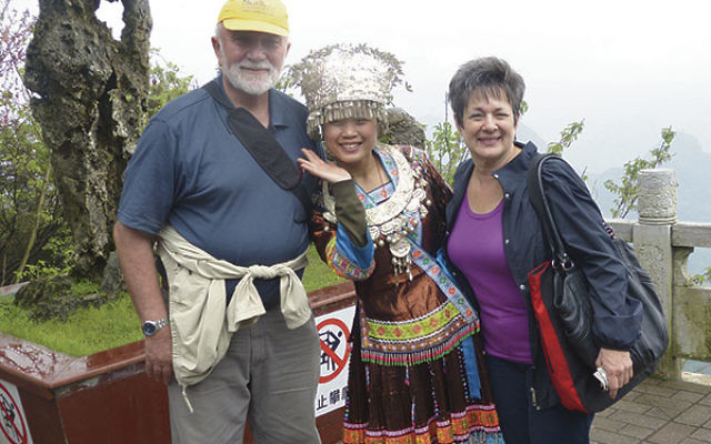 The Zelinghers with a member of a Chinese minority group at the top of Yao Mountain outside of Guilin, China. They reached the summit of this 3,000-foot mountain by cablecar.     