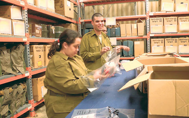 Special in Uniform IDF soldiers prepare packets of medical supplies for an Israeli field hospital.