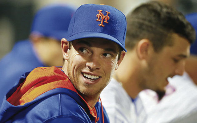 Steven Matz looking in the dugout during a game against the Chicago Cubs at Citi Field in New York City, July 1, 2015. Jim McIsaac/Getty Images