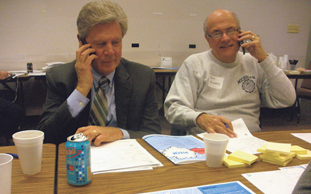 Rep. Frank Pallone, left, is joined by federation campaign chair Jeffrey Schwartz in making phone calls on Super Sunday.     