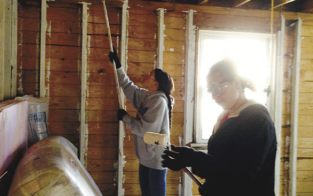 Members of Jewish Federation of Monmouth County’s Sandy Teen Fellows on their first day of volunteer work on the Sea Bright house of Desiree Pierce, April 6.