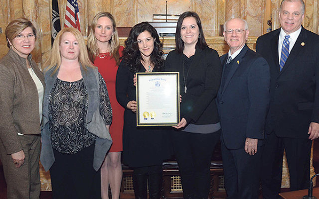 At the presentation of the proclamation to the NJ Coalition Against Human Trafficking are, from left, State Sen. Nellie Pou; Dawne Lomangino-DiMauro, cochair of the Atlantic County Anti-Trafficking Task Force; coalition member Dr. Nicole Bryan of Rutgers