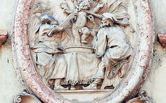 This plaque at the Palazzo Salvadori in Trent, Italy, illustrates the supposed martyrdom of Simon of Trent at the hands of Jews.     