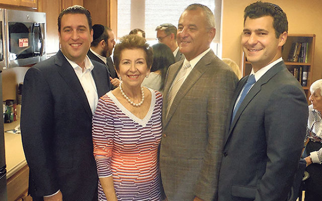 Danny and Claire Kahane, center, are joined by their son-in-law Richard Pomerantz, left, and their son Jason at the dedication of the new Bikur Cholim Room at Trinitas, which they funded in honor of their respective parents.     