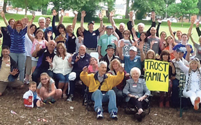A big hurrah from four generations of the Trost family — 59 members in all — gathered for a reunion picnic on June 21 in Warinanco Park. Matriarch Ann German is seated in front, to the left of the sign.    
