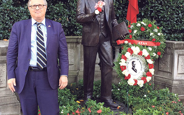Dr. Mark Meirowitz by the statue of Mustafa Kemal Ataturk, the founder of the Turkish Republic, next to the Turkish Embassy in Washington, DC.