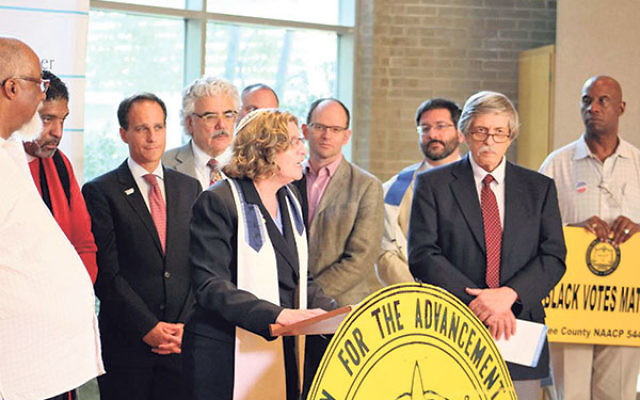 Rabbi Joel Abraham, third from right, takes part in a press conference about the Nitzavim campaign in Raleigh, NC, with other rabbis and state NAACP leaders. 