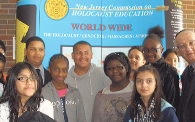 Dr. Paul Winkler gathers with students from McGinnis Middle School in Perth Amboy before the start of the Yom Hashoa program at Middlesex County College in Edison, May 2011.    
