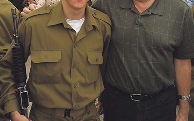 Hirsch Alter, left, who grew up at EBJC, became a member of the IDF in November. Through Yashar LaChayal, the synagogue plans to donate rain gear and water backpacks to all 125 soldiers in his unit. 