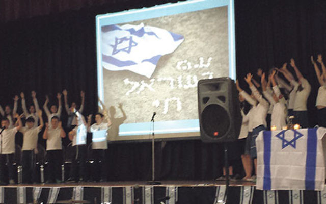 Children from the JEC Yeshiva of Elizabeth choir sing in celebration of Israel at the Union Y.     