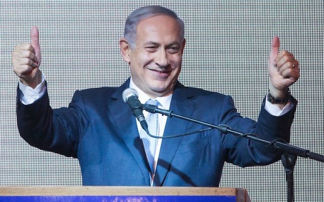 Israeli Prime Minister Benjamin Netanyahu celebrating after the close of polls on Election Day, March 18, 2015. (Miriam Alster/FLASH90)