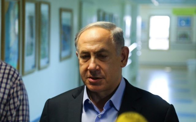 Israeli Prime Minister Benjamin Netanyahu visiting the hospitalized family of a West Bank Palestinian baby killed in an arson attack, July 31, 2015.