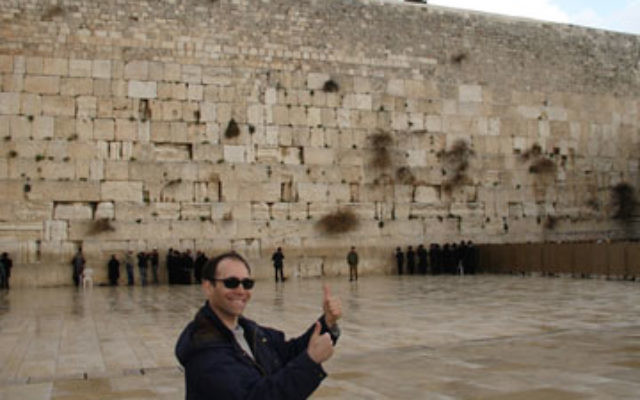 Giving Israel the thumbs up, recent immigrant from New Jersey Gil Margulis gives his vote of approval to the Kotel…