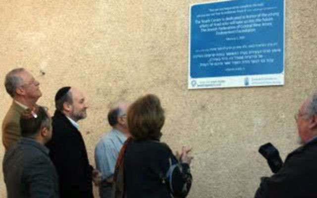 Jewish Federation of Central New Jersey leaders attend the unveiling of a plaque at the Young Adult Center in Arad last winter, financed by a grant from the Ness Fund.