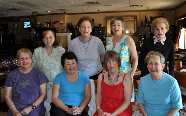 Shelly Freedman, front row, right, meets with members of Women on Their Own, from left, front row, Marge Cohen, Rita Ferraro, and Neshama Siner, and, back row, Barbara Rosen, Anita Lepelstat, Lynda Goldschein, and Ann Lubin.