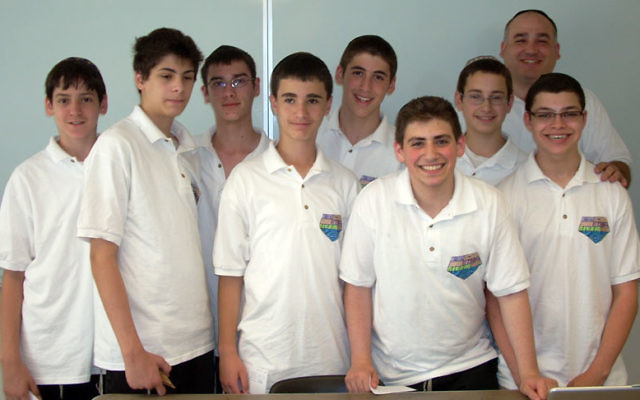 A team of students at the Rav Teitz Mesivta Academy, led by mentor Ken Dietz, rear right, have won a place in the final round of the Gildor Project science competition in Israel. Photo courtesy JEC