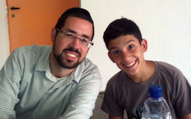 Rabbi Joshua Hess of Linden with a young Israeli at the Counterpoint summer camp in Arad.